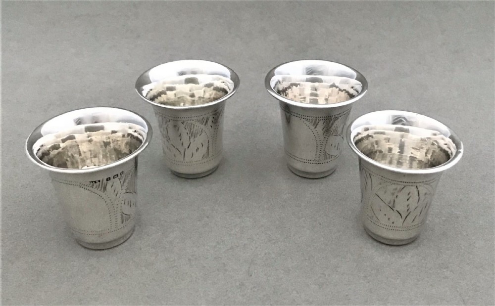 A rare set of four hallmarked silver shot or tot cups View II