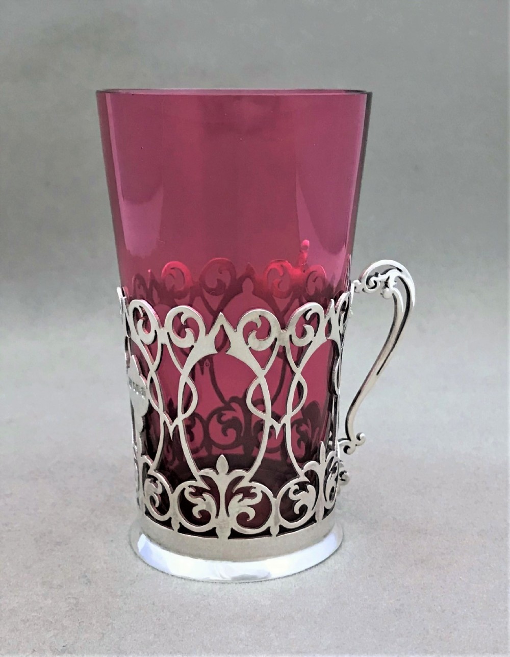 A lovely Art Nouveau silver beaker holder