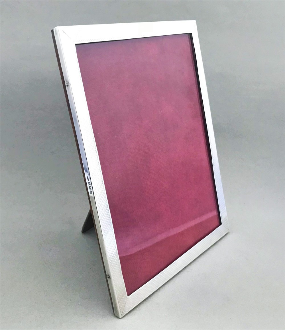 An attractive engine turned silver photo frame