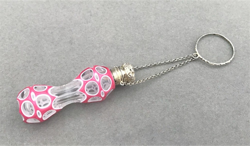 An exquisite silver mounted miniature scent bottle