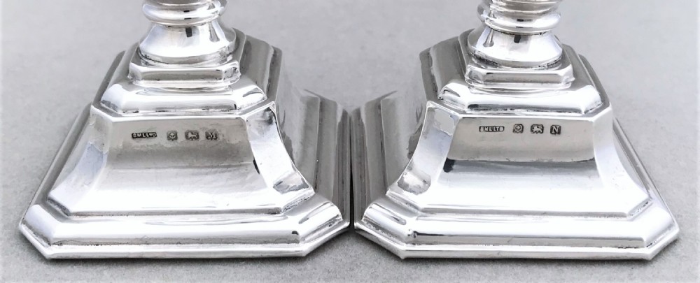 A pair of Art Deco silver candlesticks View V
