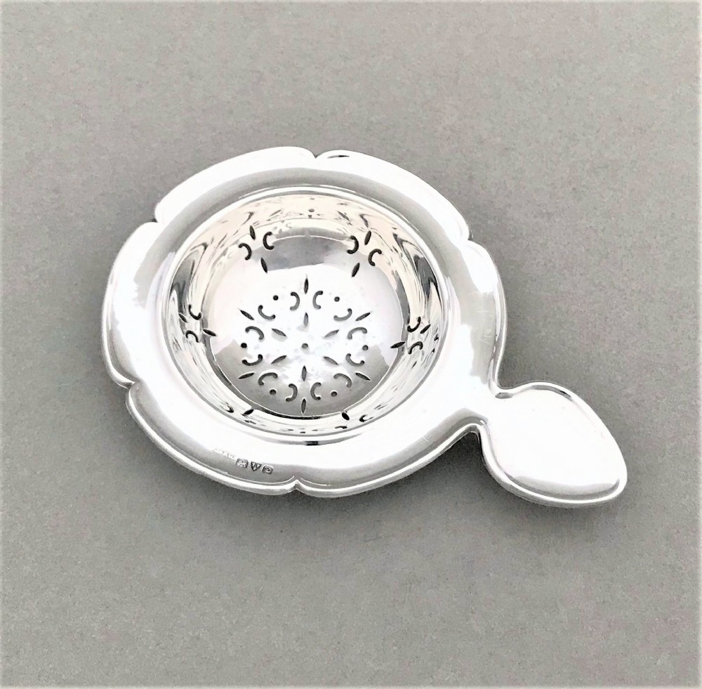 An attractive Chester silver tea strainer