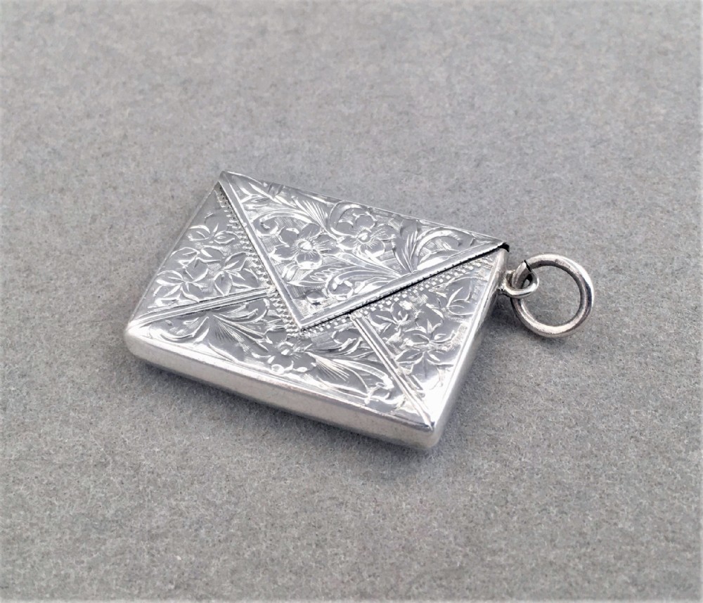 A charming Edwardian silver stamp case