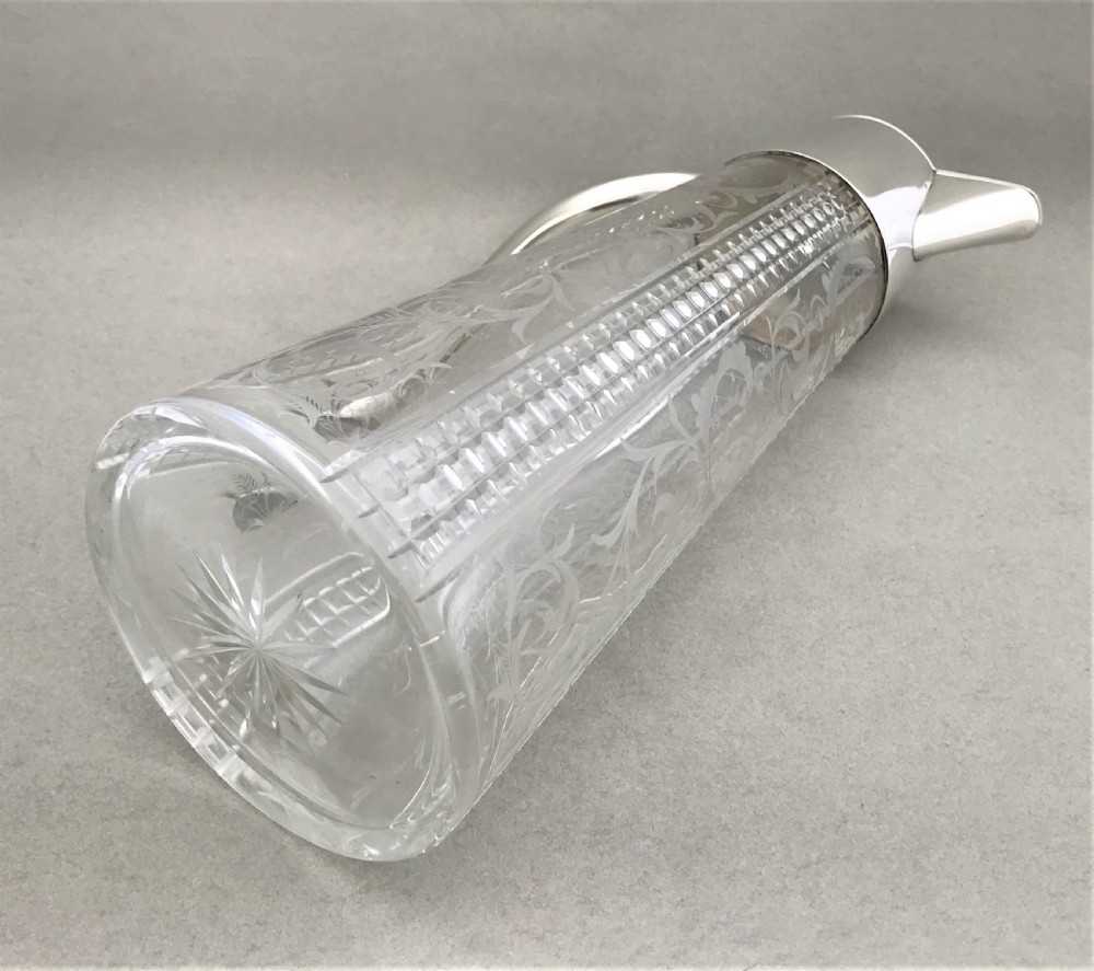 A delightful silver plated claret jug View IV