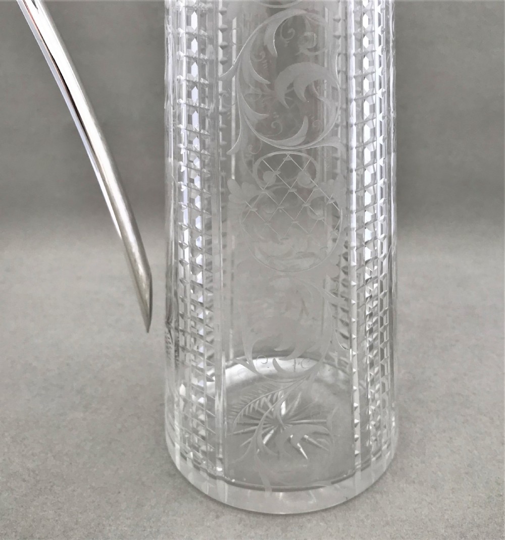 A delightful silver plated claret jug View VI