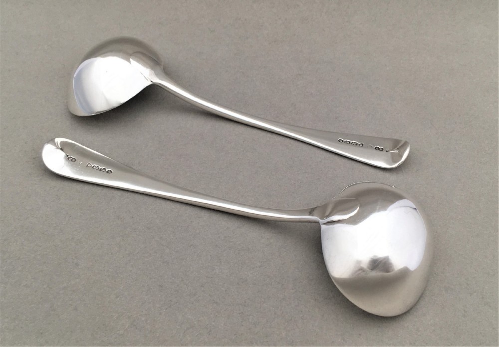 A pair of Victorian silver gravy ladles by George Adams View V