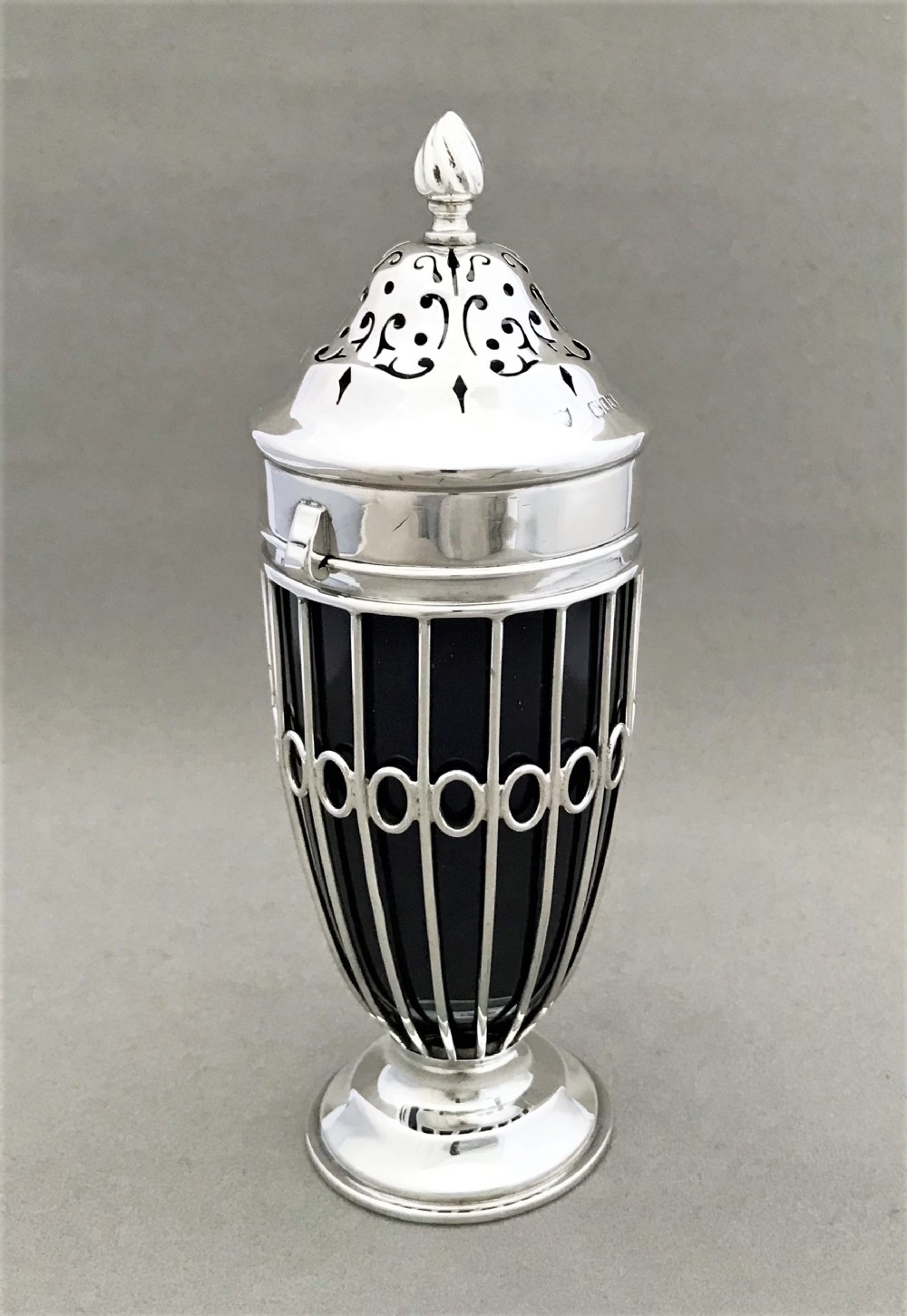 An elegant Edwardian silver wirework sugar caster