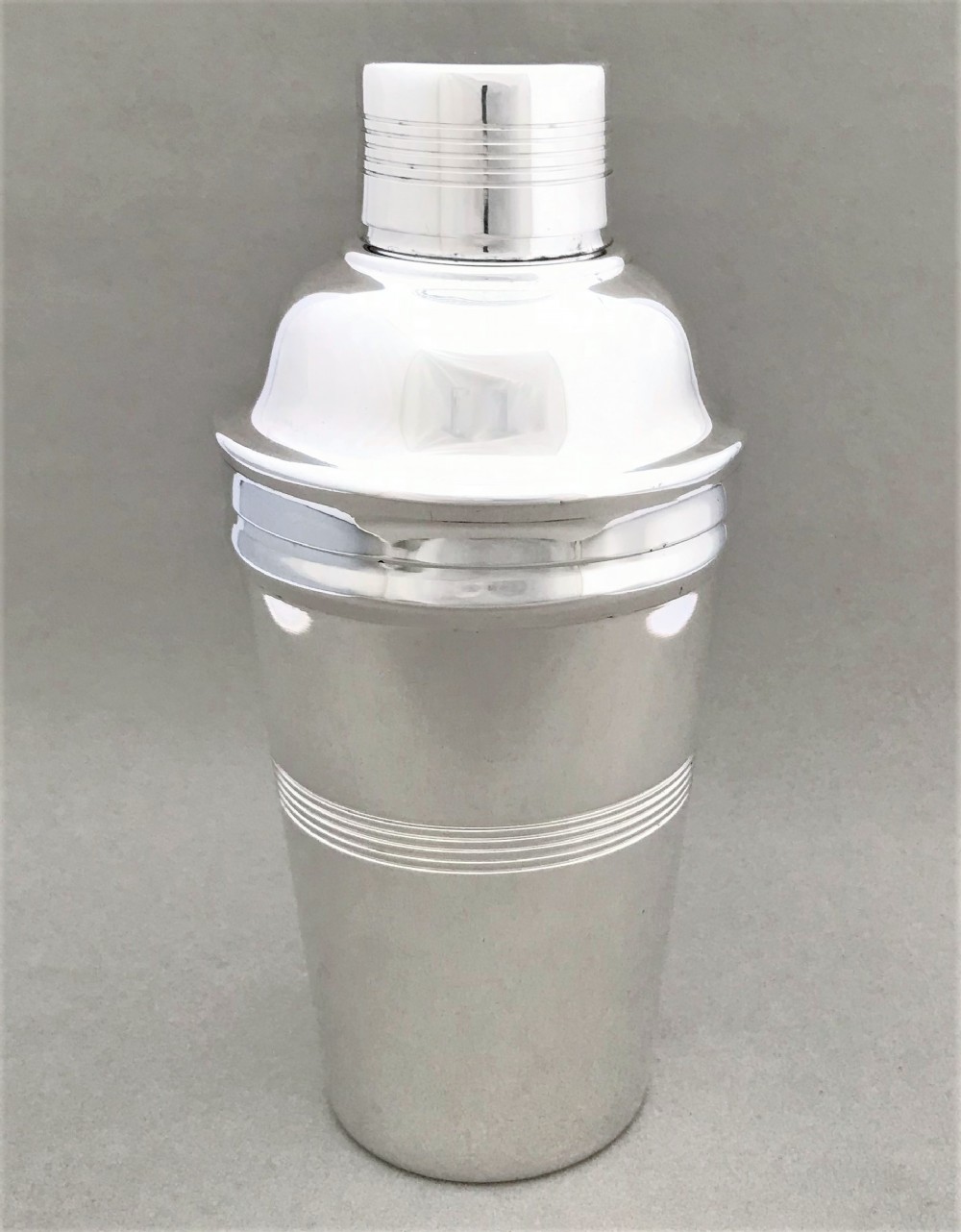 An Art Deco silver plated cocktail shaker