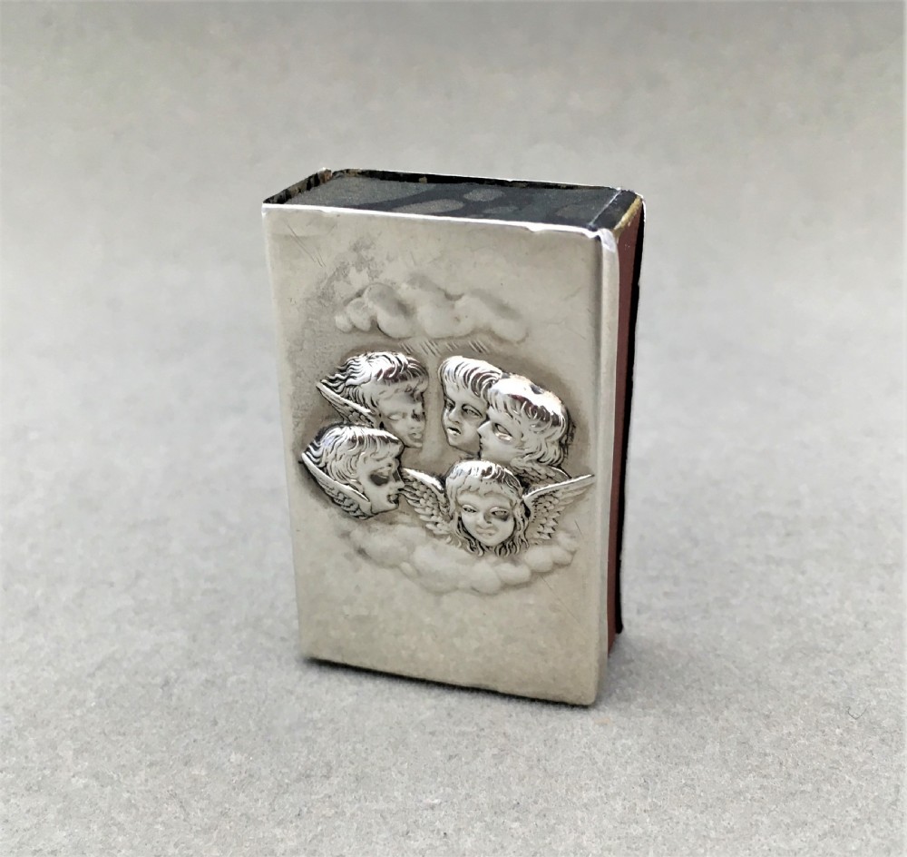 A silver Reynolds Angels embossed matchbox case