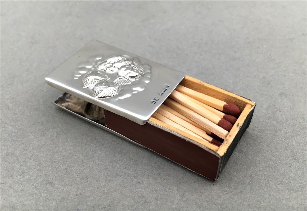 A silver Reynolds Angels embossed matchbox case View IV