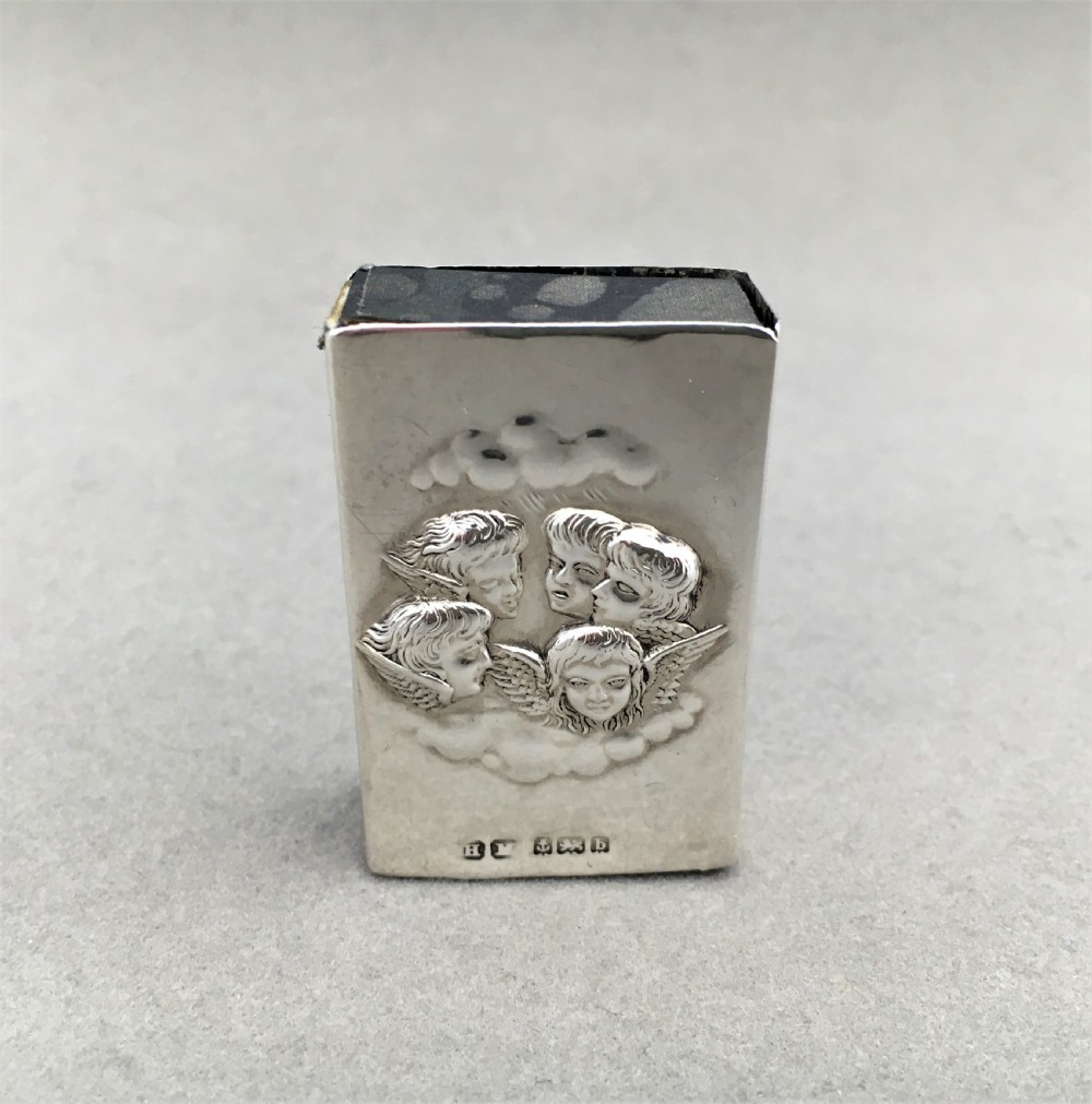 A silver Reynolds Angels embossed matchbox case View V