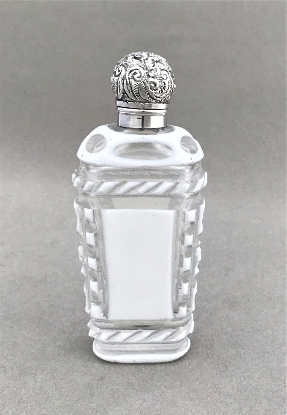 A Fabulous silver mounted cut through scent bottle