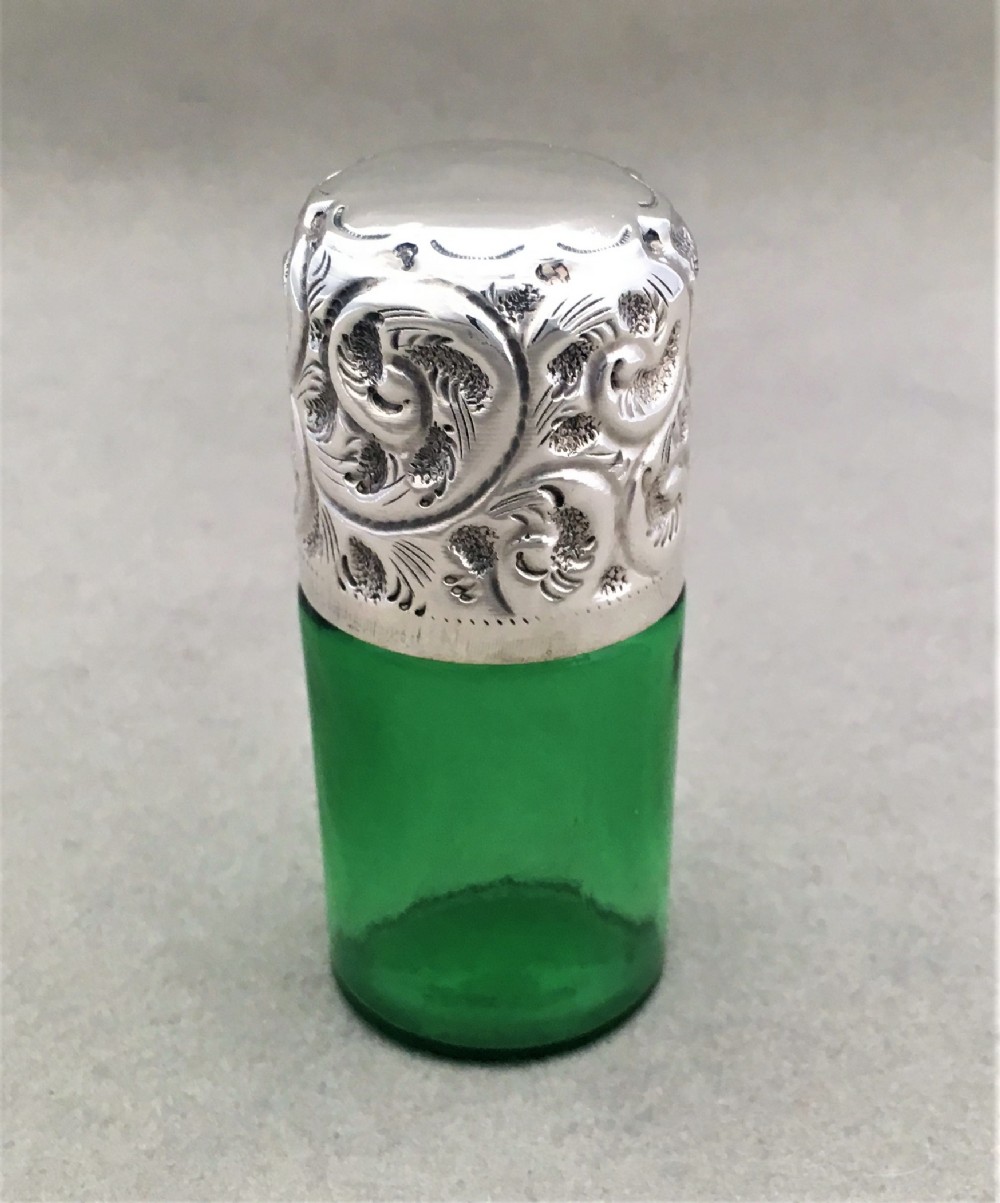 A silver mounted Edwardian scent bottle