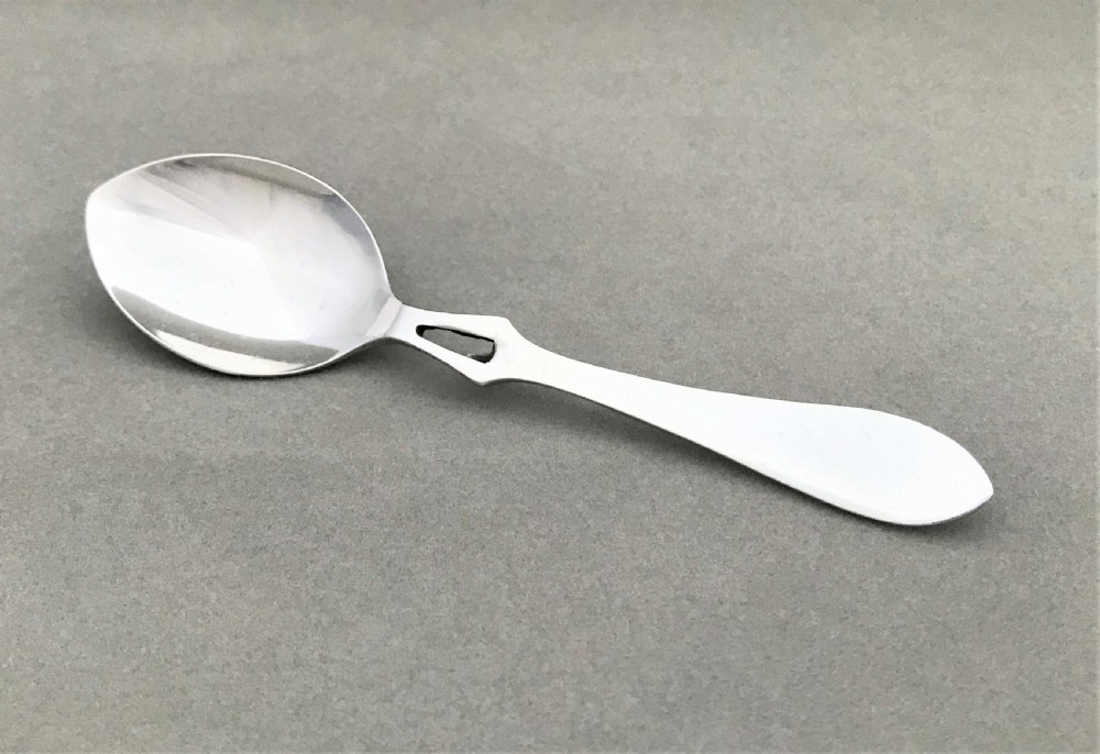 A desirable George V silver honey spoon