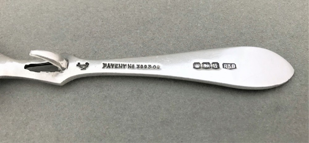 A desirable George V silver honey spoon View III