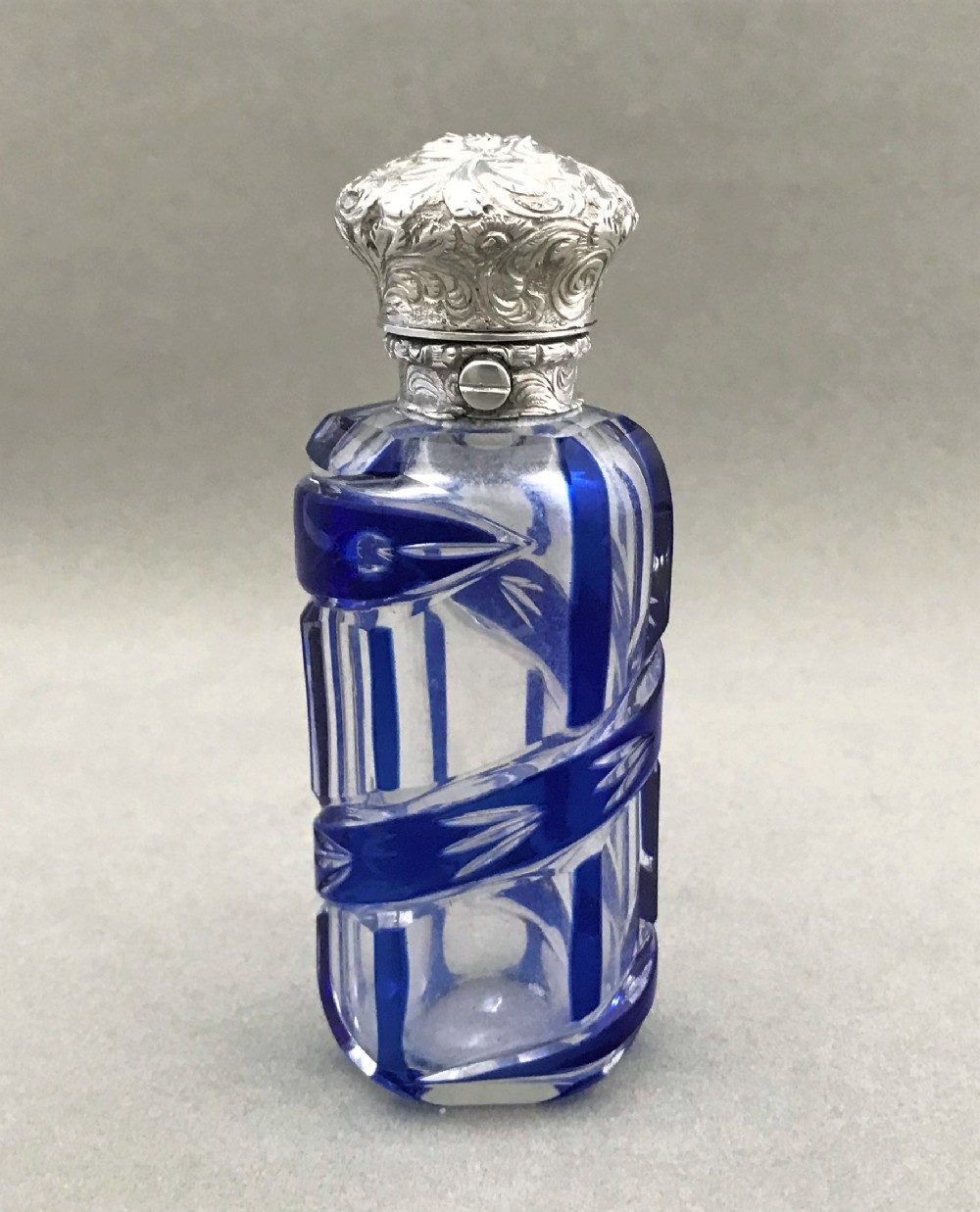A Victorian silver mounted cut through scent bottle