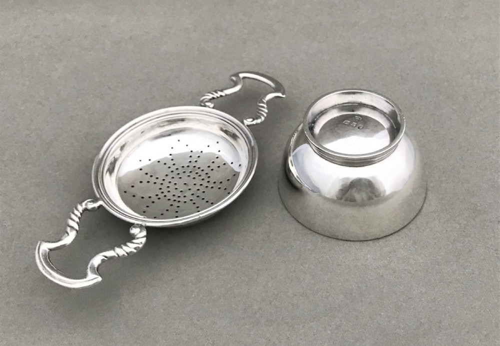 A charming silver tea strainer & drip cup View IV
