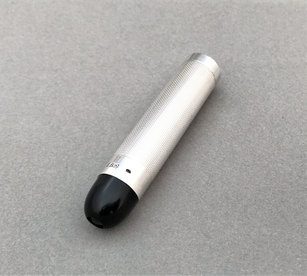 A stylish Art Deco silver theatre programme torch