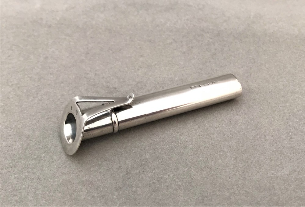 A delightful Chester silver buttonhole holder