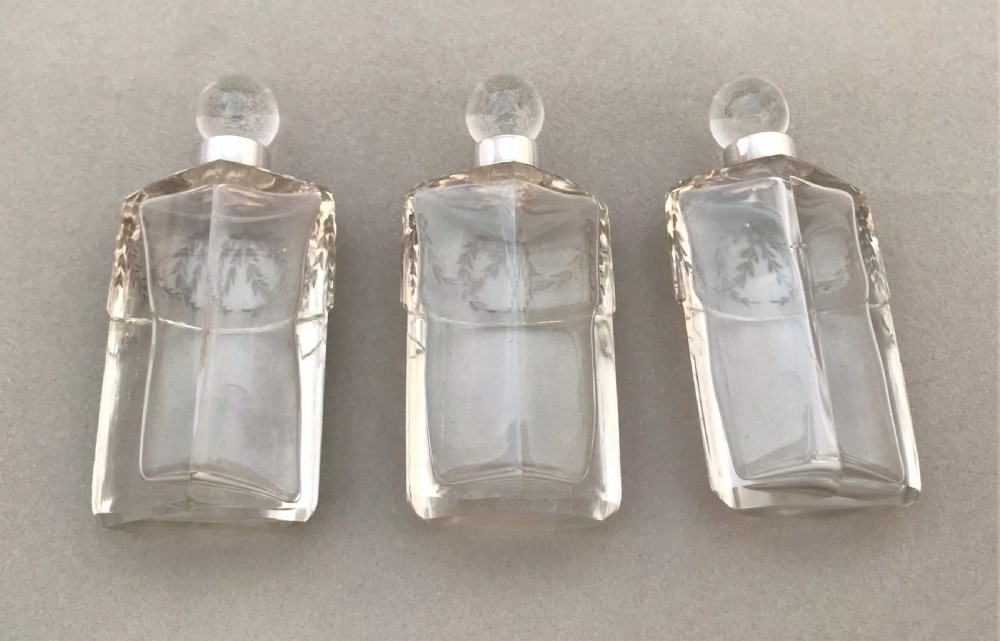 A gorgeous Edwardian silver mounted trio of scent bottles View VI