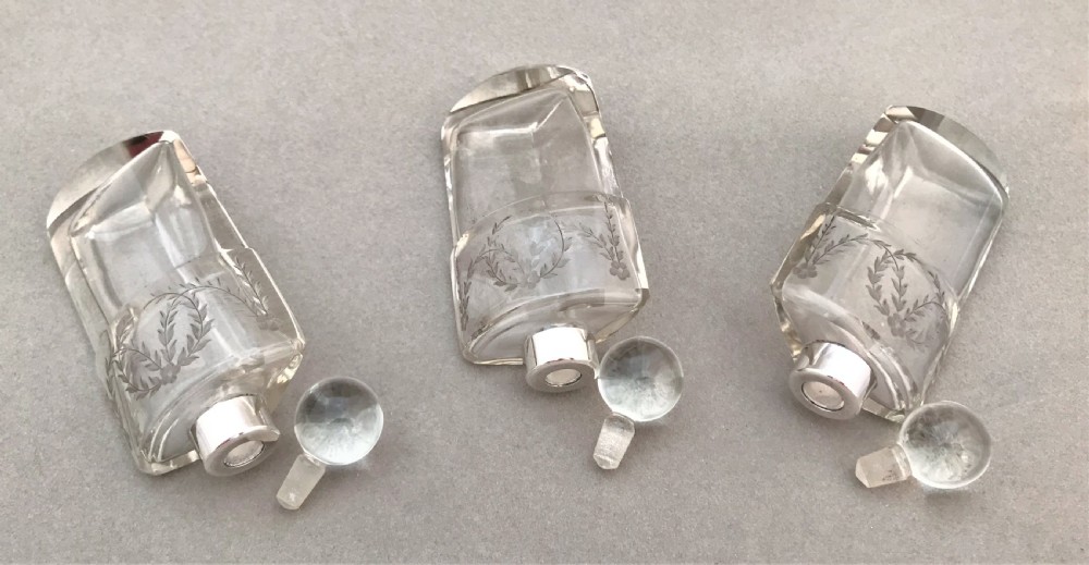A gorgeous Edwardian silver mounted trio of scent bottles View VIII