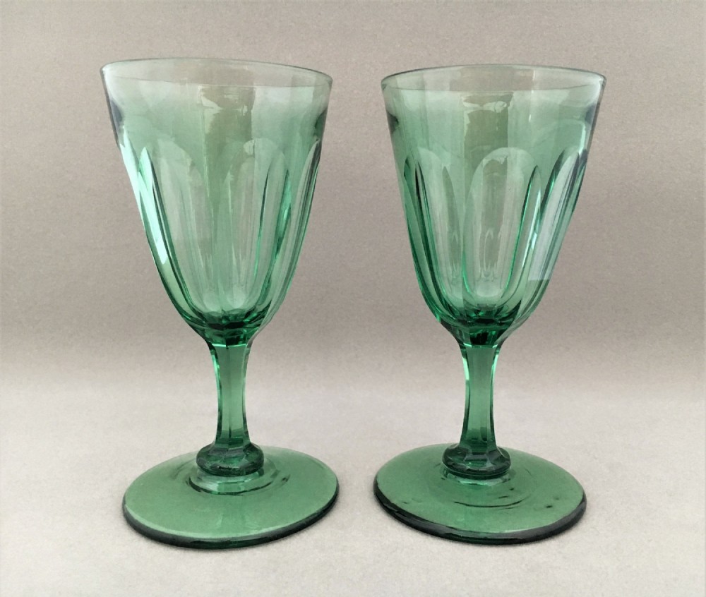 A lovely pair of early Victorian green wine glasses