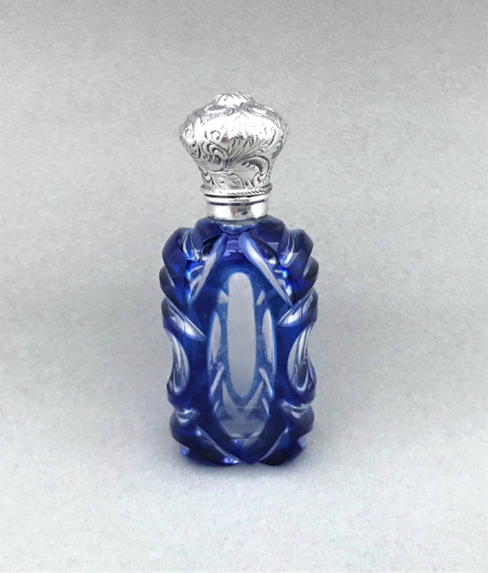 A gorgeous Victorian silver mounted overlay scent bottle