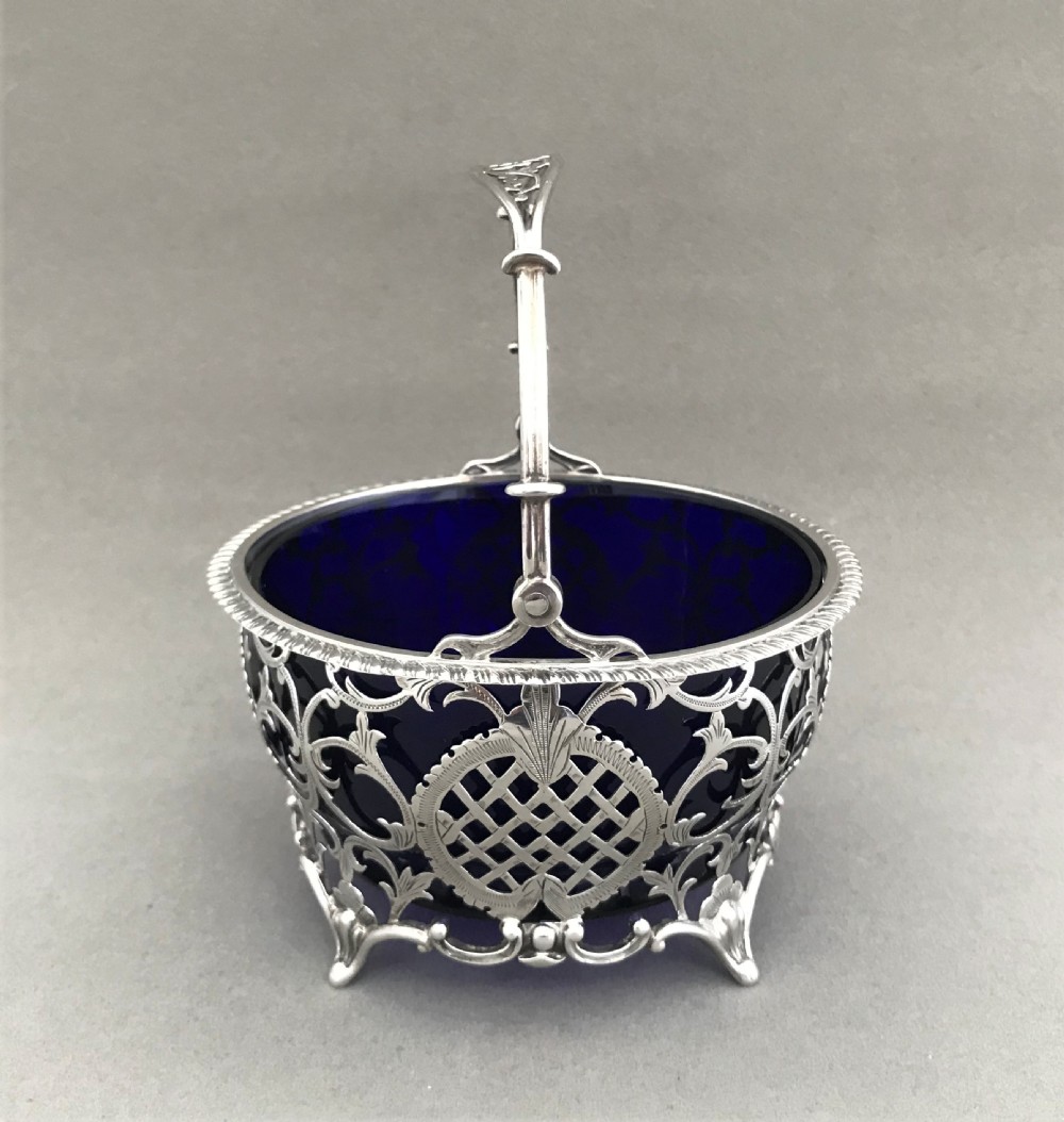 A superb pierced silver swing handled basket View II