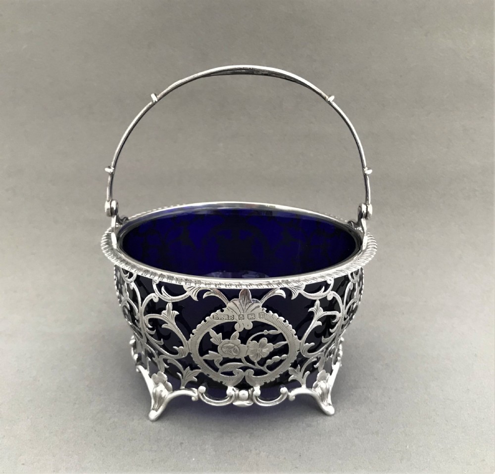 A superb pierced silver swing handled basket View III