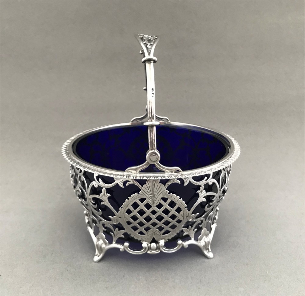 A superb pierced silver swing handled basket View IV