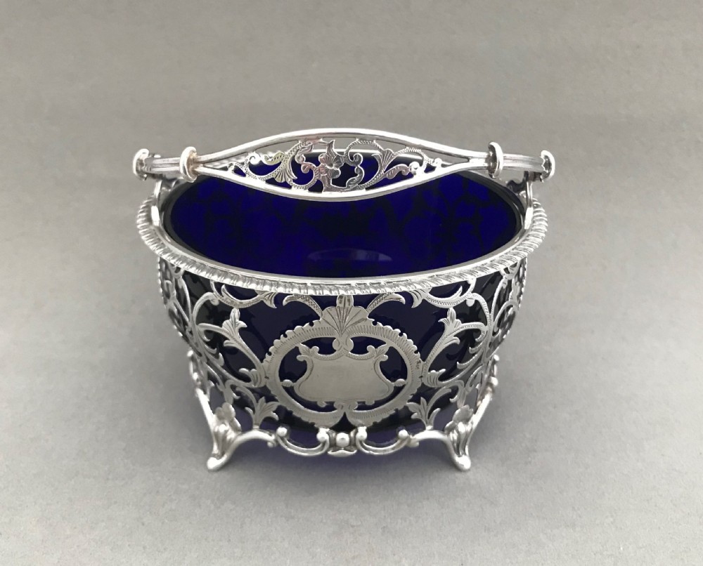 A superb pierced silver swing handled basket View V