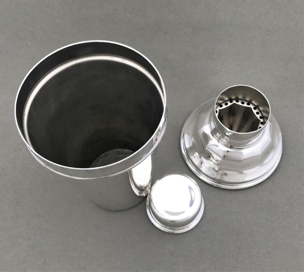 A rare silver plated cocktail shaker with lemon squeezer View VI