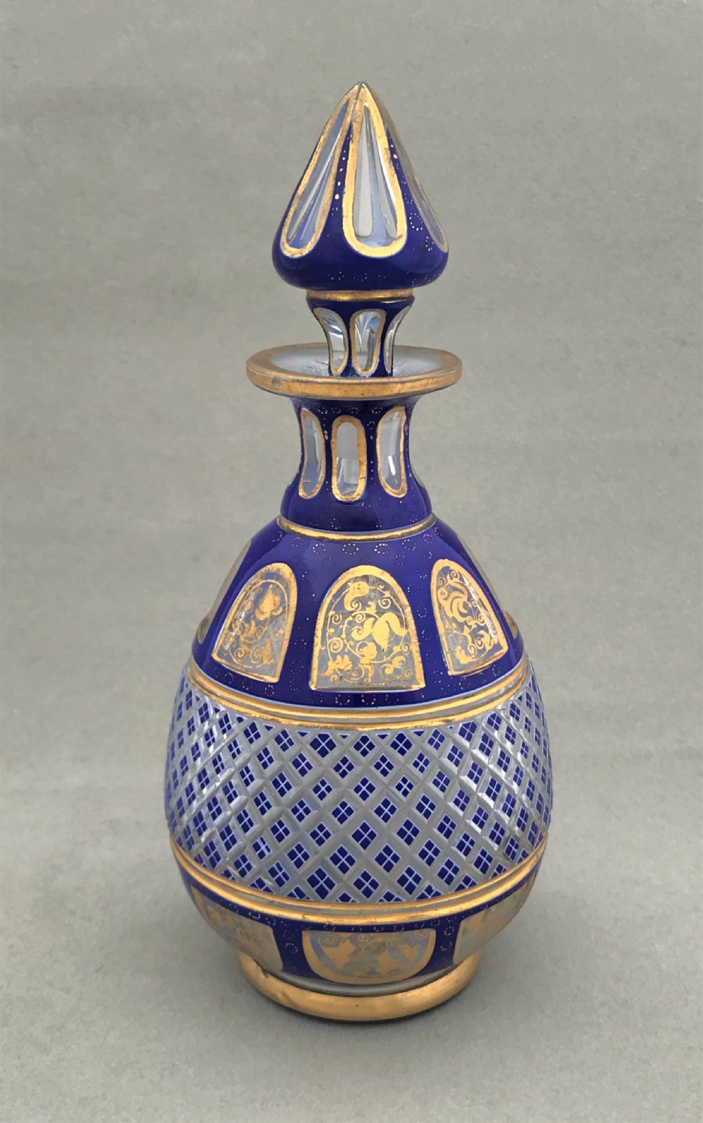 A fabulous overlay and gilded Bohemian cologne bottle