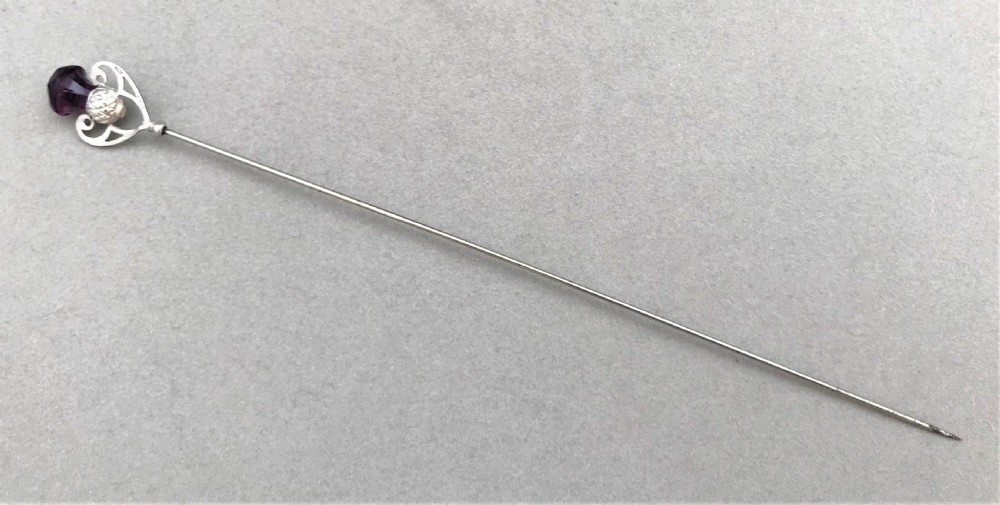 A gorgeous silver hatpin with thistle motif terminal View II