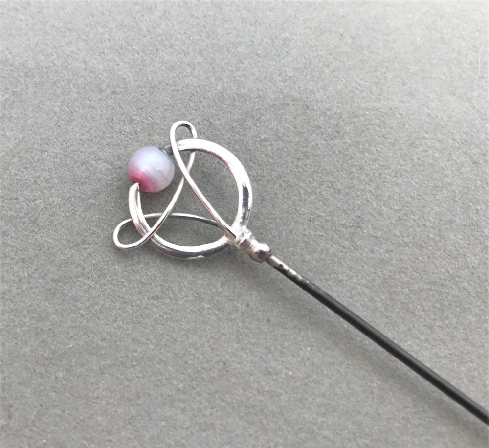A lovely Art Nouveau silver hat pin by Charles Horner