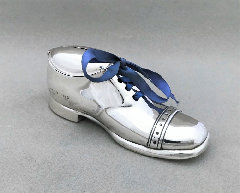 An extremely rare novelty silver 'shoe' money box View II