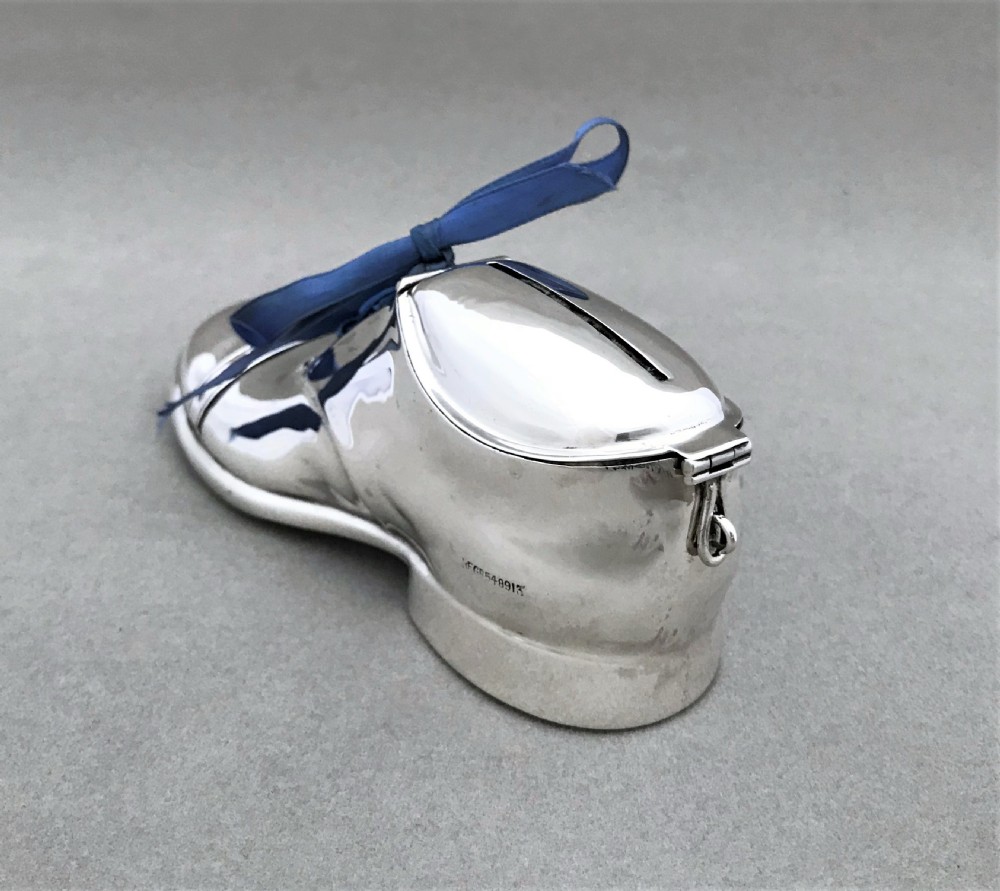 An extremely rare novelty silver 'shoe' money box View V