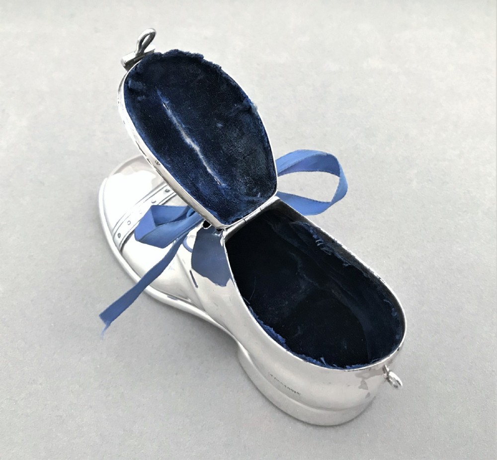 An extremely rare novelty silver 'shoe' money box View VIII