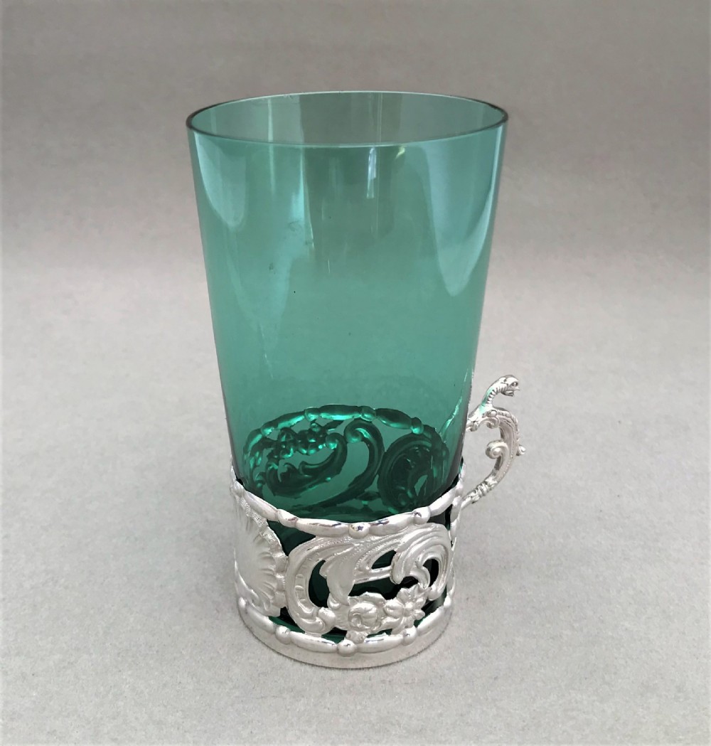 An Edwardian William Comyns silver cup holder & beaker