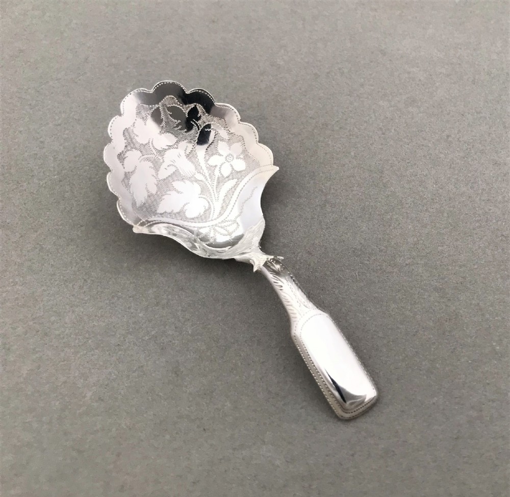 An unusual Georgian silver caddy spoon View V