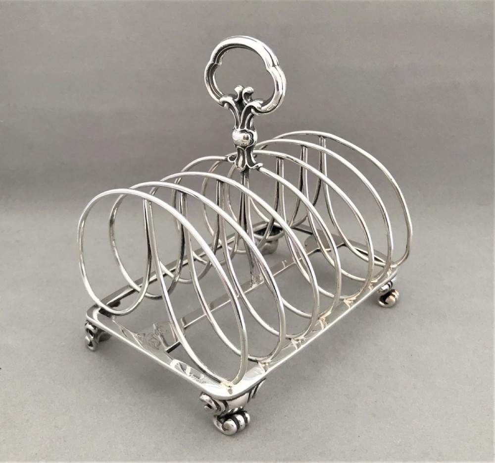 An outstanding large Victorian silver toast rack by Garrards