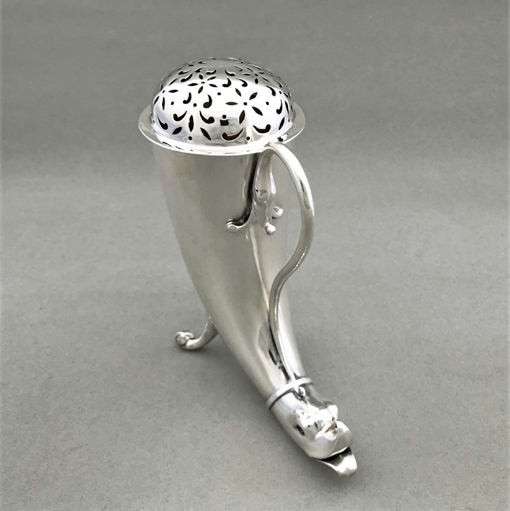 An outstanding Irish silver 'cornucopia' silver sugar caster View II
