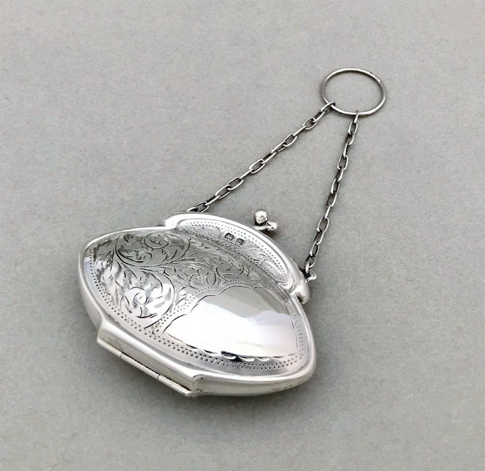 A lovely acanthus engraved silver cocktail purse