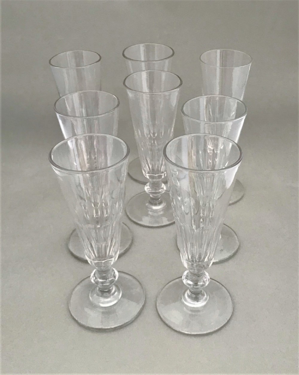 A wonderful set of 8 Victorian cut glass champagne flutes