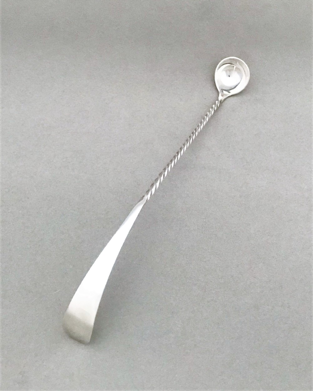 An extremely rare Victorian silver olive or pickle spoon