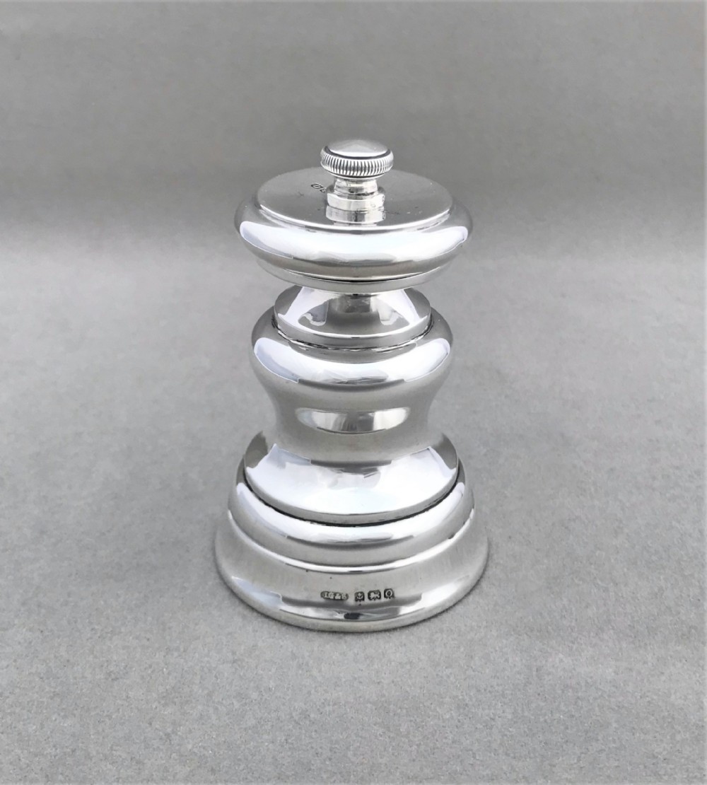 A handsome all silver pepper grinder