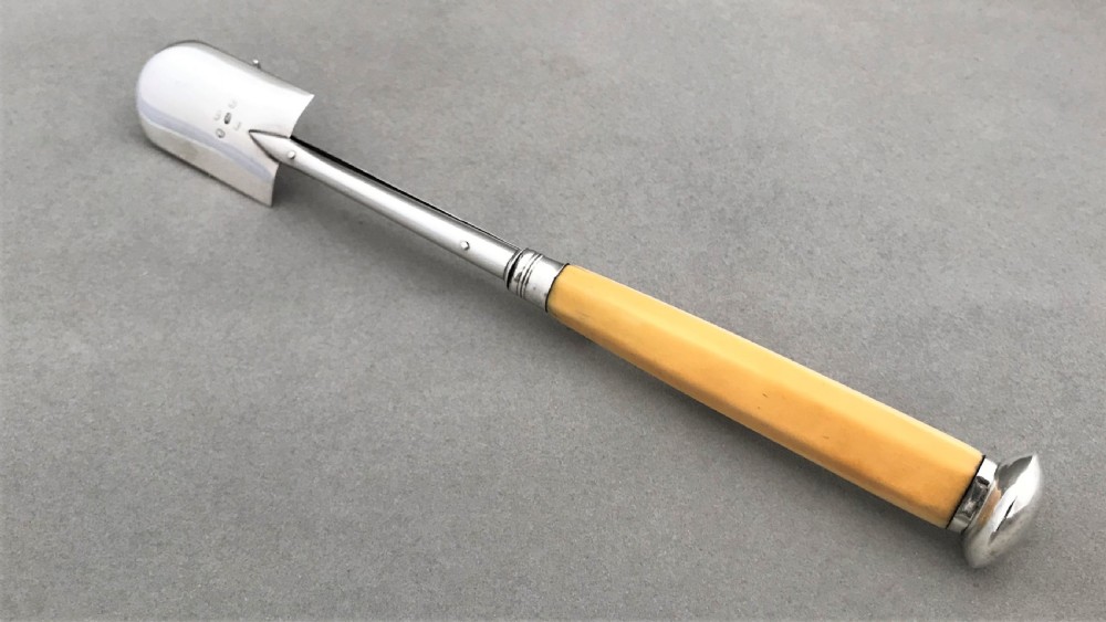 A wonderful Georgian silver stilton scoop with 'push release' mechanism View III