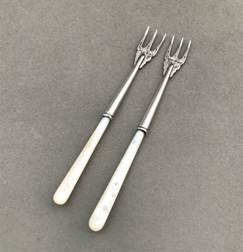 A charming pair of Victorian Chester silver pickle forks