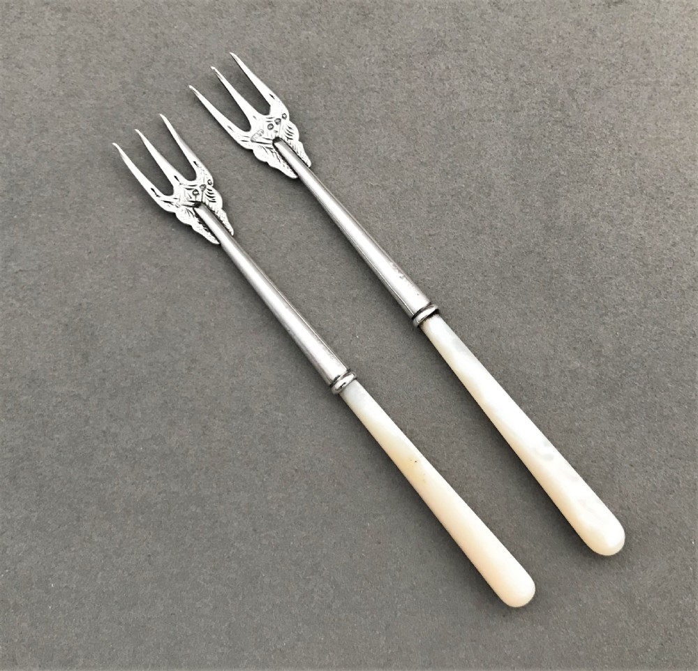 A charming pair of Victorian Chester silver pickle forks View II