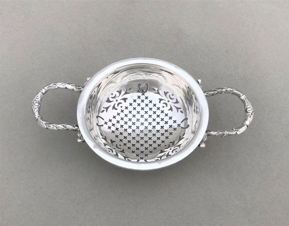 An attractive silver tea strainer View III